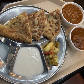 Paratha Grill signature dishes Aloo Paratha, Gobi Paratha, Chicken Tikka Masala Bowl, Paneer Tikka Wrap